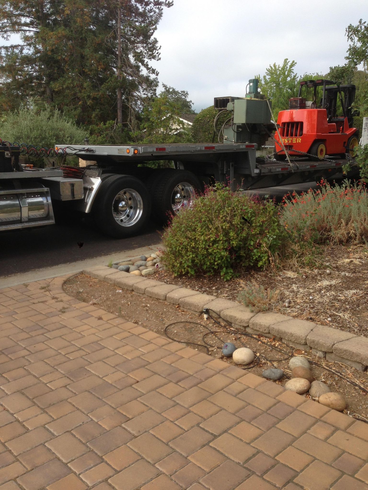 The mill arriving on a hired lowboy truck