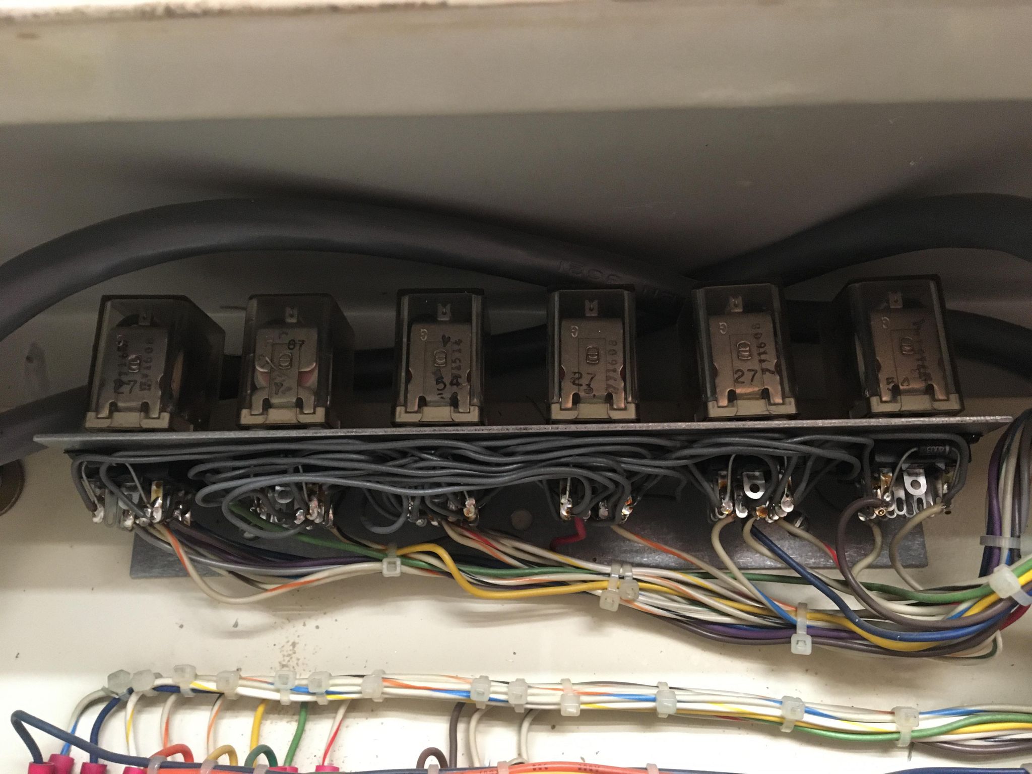 Horrible rat's nest of relays retrofitted to replace the side panel buttons